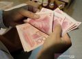 Yuan tergelincir lagi 122 basis poin menjadi 6,9920 terhadap dolar AS