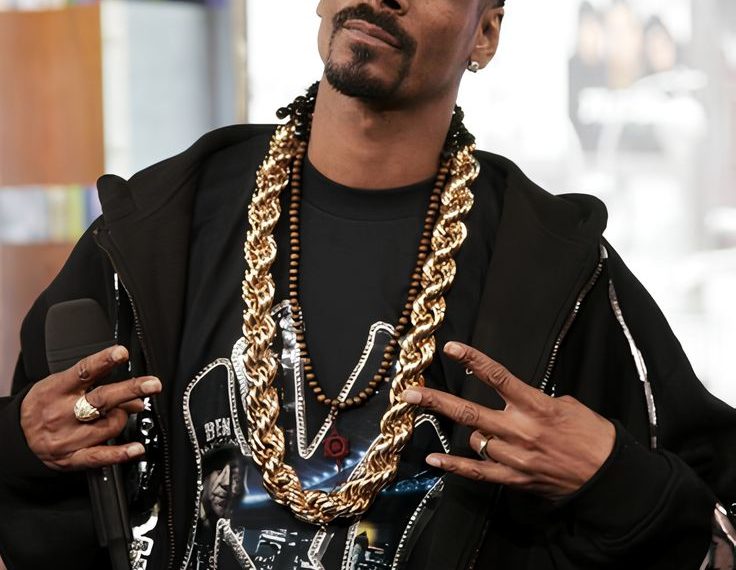 Coach Snoop Ramaikan Olimpiade Musim Dingin dengan Gaya Nyentrik