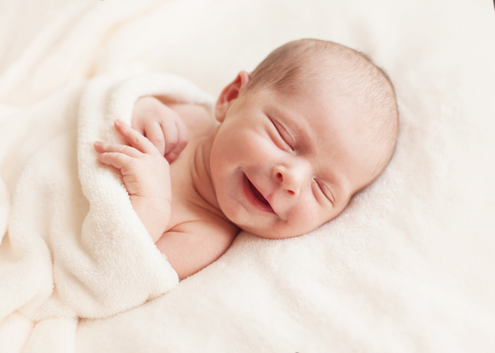Why Do Babies Smile in Their Sleep?