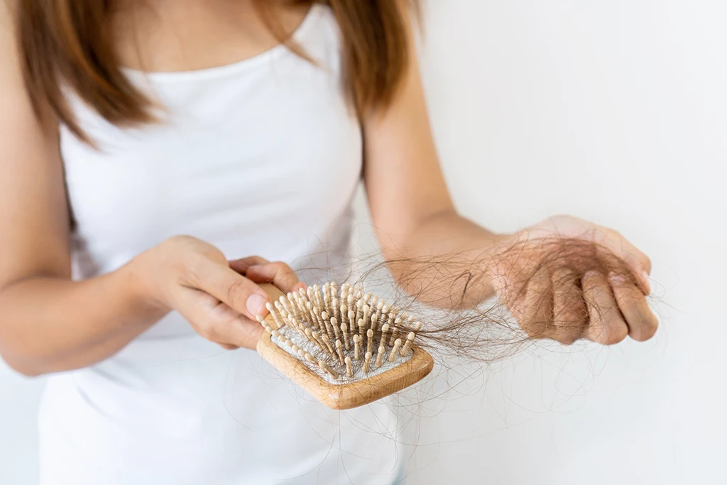 How Much Hair Loss Is Normal? Here’s What Experts Say