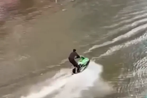 Man Arrested After Riding Jet Ski Through Flooded Bangkok Street