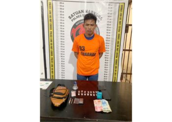Tersangka Suwandi alias Wawan dan barang bukti