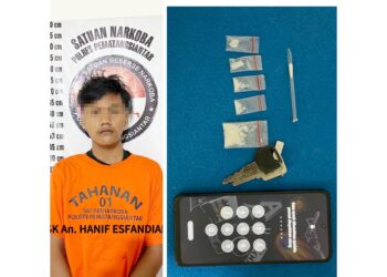 Tersangka HE alias Hanif beserta barang bukti
