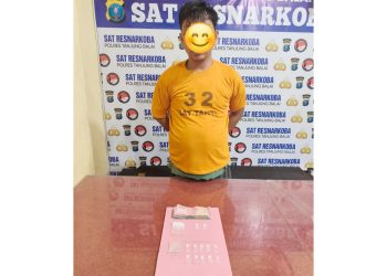 Tersangka MP alias U dan barang bukti