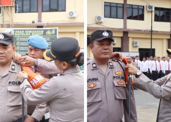 Kapolres Pematangsiantar AKBP Sah Udur T.M. Sitinjak SH. SIK. MH pasang band lengan Pamapta kepada AIPTU Krisman Sembiring dan AIPTU Sarmail Bahagia Purba