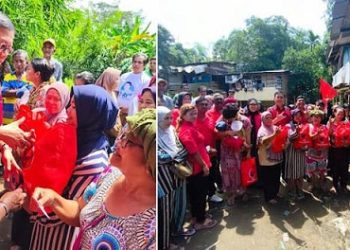 Ketua DPC PDI Perjuangan Medan, Hasyim menyerahkan bantuan kepada masyarakat yang terdampak banjir di Medan Polonia. (Foto Ist)