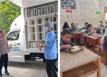 Bhabinkamtibmas Kelurahan Pardomuan AIPDA Hardi N. Silalahi bersama Pawas Distribusi SPPG IPDA B. Rajagukguk monitoring distribusi Makanan Bergizi Gratis (MBG) di SMP Negeri 1