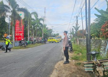 Kapolsek Tanah Jawa Kompol Asmon Bufitra SH. MH turun langsung Gatur Lalin