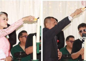 Kapolres Pematangsiantar AKBP Sah Udur T.M. Sitinjak SH. SIK. MH, Kasat Samapta  Ketua Panitia Natal AKP Mariduk Tambunan SH. MH saat penyalaan lilin