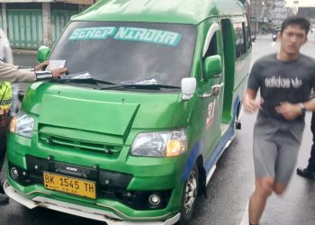 Kanit Kamsel IPDA Serly Tarigan bersama personil saat sosialisasi di Jalan Sutomo