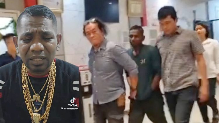 Influencer Mr Roberto saat digiring personel Satreskrim Polrestabes Medan menuju ruang tahanan. (Foto Ist)
