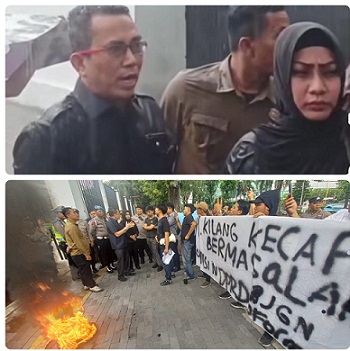 Ketua Komisi 4 DPRD Medan Paul Mei Anton Simanjuntak SH didampinggi anggota Lailatul Badri saat menerima massa pengunjuk rasa soal limbah pabrik kecap Cap Hati Angsa - PT Kilang Kecap Angsa di Jalan Bono, Kecamatan Medan Timur ditengah guyuran hujan. (Foto Romulo)