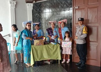 piket Bhabinkamtbmas AIPDA Saut M. Manurung dan BRIPKA I. Surya Darma melaksanakan patroli KRYD di Gereja GKPS Jalan Sudirman.