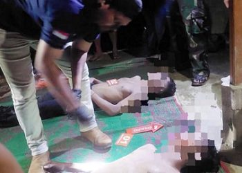 Inafis Polres Simalungun AIPD Sujid Saputra saat evakuasi kedua korban tenggelam