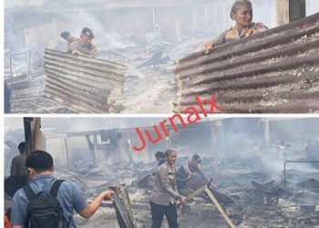 Kapolres Pematangsiantar AKBP Sah Udur T.M. Sitinjak SH. SIK. MH ikut membersihkan puing puing sisa kebakaran kios Pasar Dwikora 
