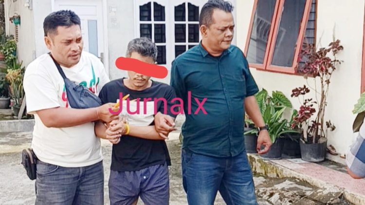Tersangka KHH alias Kisul saat ditangkap Kanit Reskrim IPDA Indrawan S.Sos bersama Tim Opsnal