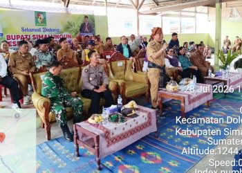 Kapolsek Dolok Silau AKP M. Nasir Daulay, S.H Amankan Kunjungan Kerja Bupati Simalungun di Nagori Cingkes