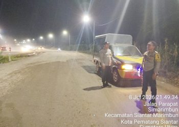 Piket Bhabinkamtibmas AIPTU Erik Marbun, AIPDA Asril manurung dan AIPDA Pardamean Butar Butar melaksanakan patroli di Ringroad
