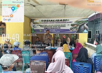 Bhabinkamtibmas Kelurahan Bah Sorma AIPDA Fadlan Fahmi menghadiri sosialisasi pengerjaan pembuatan jalan Irigasi