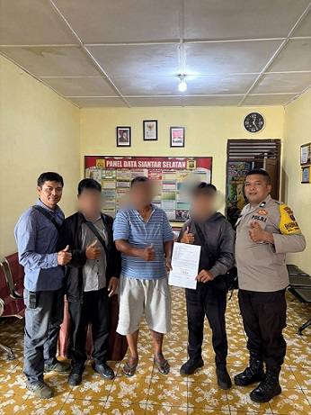 Kanit Reskrim IPDA J. Manihuruk bersama piket Bhabinkamtibmas selesaikan Selisih paham warga di Jalan Gereja