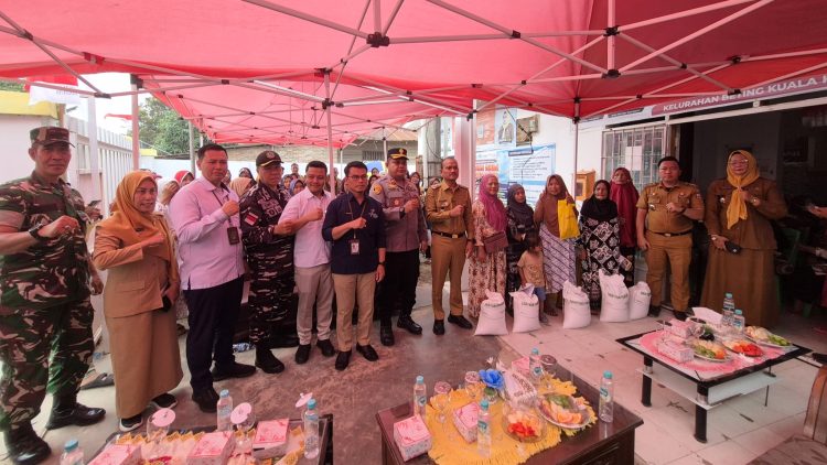 Wakapolres Tanjungbalai, Kompol Tony Simanjuntak, SH hadiri Penyerahan Bantuan Pangan Beras di Teluk Nibung