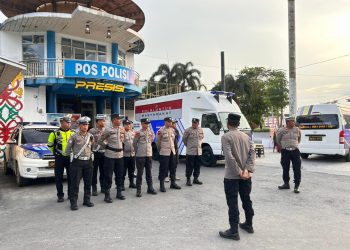 Polresta Palangka Raya menggelar apel kesiapan pengamanan di kawasan Bundaran Besar, Kota Palangka Raya, Minggu (27/7/2025).
