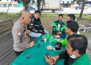 Satuan Binmas Polres Ogan Ilir melaksanakan kegiatan Cooling System dengan menyambangi komunitas pengemudi Grab di Terminal Timbangan, Kecamatan Indralaya Utara, Kabupaten Ogan Ilir, Kamis (12/03/2026).