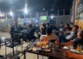 Koramil jajaran Kodim 0207/Simalungun bersama warga menggelar kegiatan nonton bareng (nobar) pertandingan final antara Prancis melawan Inggris, Minggu (19/7/2026) dini hari.