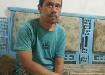 Aladin Panggabean (45), warga Dusun 6, Desa Perkebunan Aek Loba, Kecamatan Aek Kuasan, Kabupaten Asahan, Sumatera Utara.