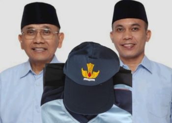 Baju olah raga SMP Negeri dengan latar belakang Bupati dan Wakil Bupati Simalungun, Anton Achmad Saragih dan Benny Gusman Sinaga