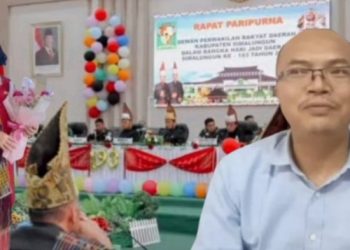 Setwan Justina Nuriati Purba bersama ketua Komisi II Maraden Sinaga dengan latar belakang suasana Paripurna