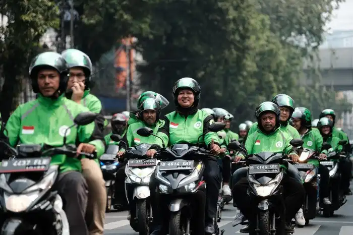 Pemerintah Pangkas Potongan Aplikasi Ojol Hingga 8%, Pihak Grab dan Gojek Beri Respons 